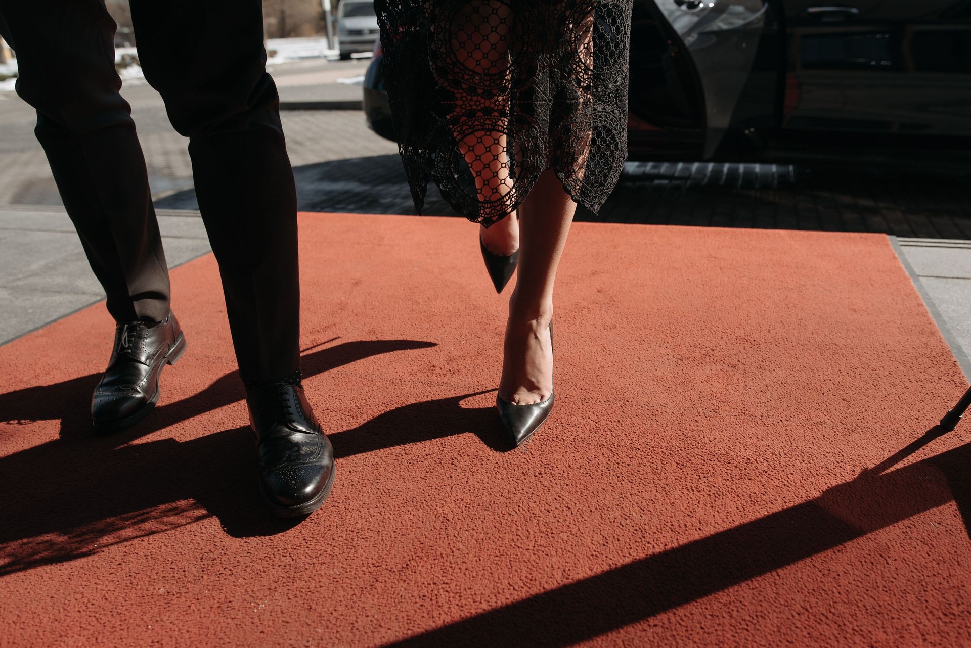 Stylish couple on red carpet, showcasing fashion and elegance at a prestigious event.